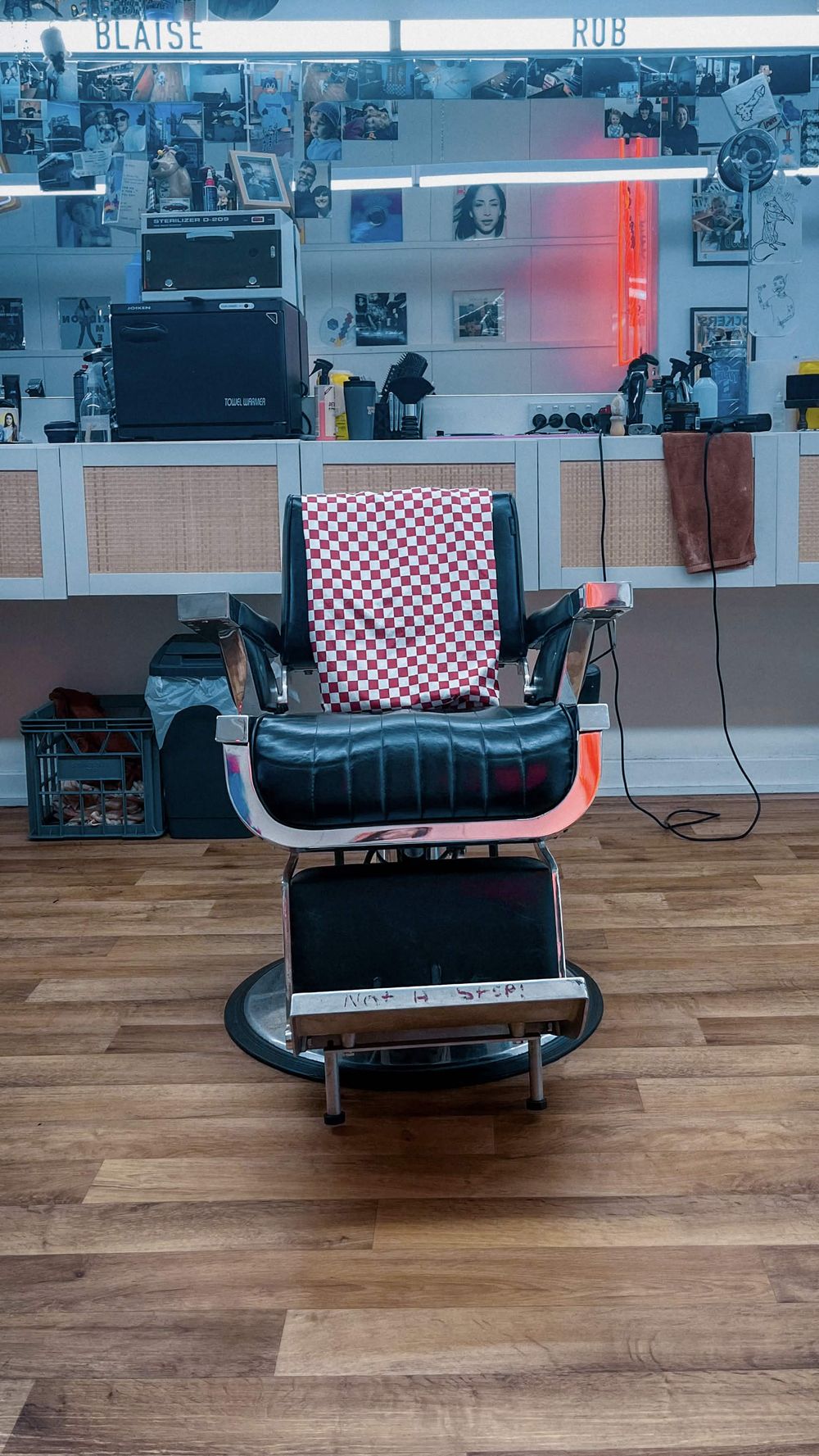 Rob's vintage barber chair with a red checked towel at Lil' Ricky's, North Perth
